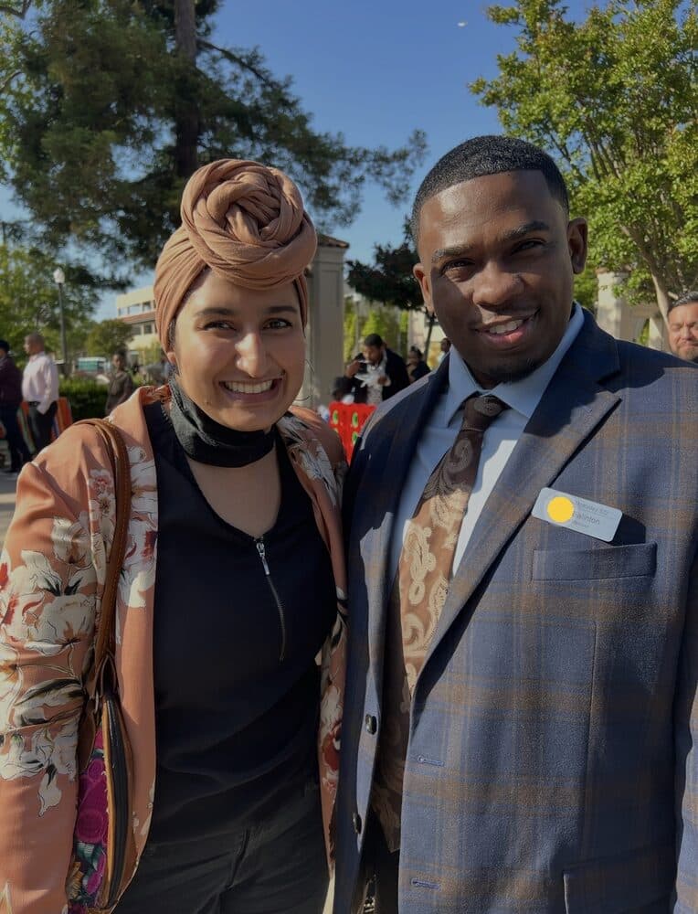 Milan Balinton outdoors with Maimona Afzal Berta, Board Member of the Santa Clara County Office of Education